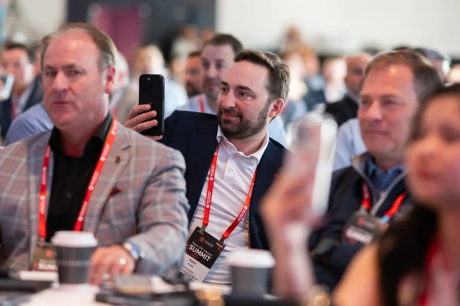 Summit attendees focused on a mainstage presentation