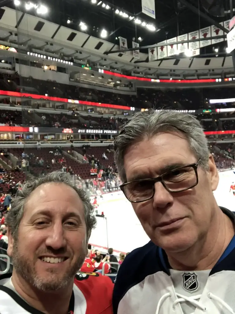 David Sobel and Norm Curtis at a hockey game